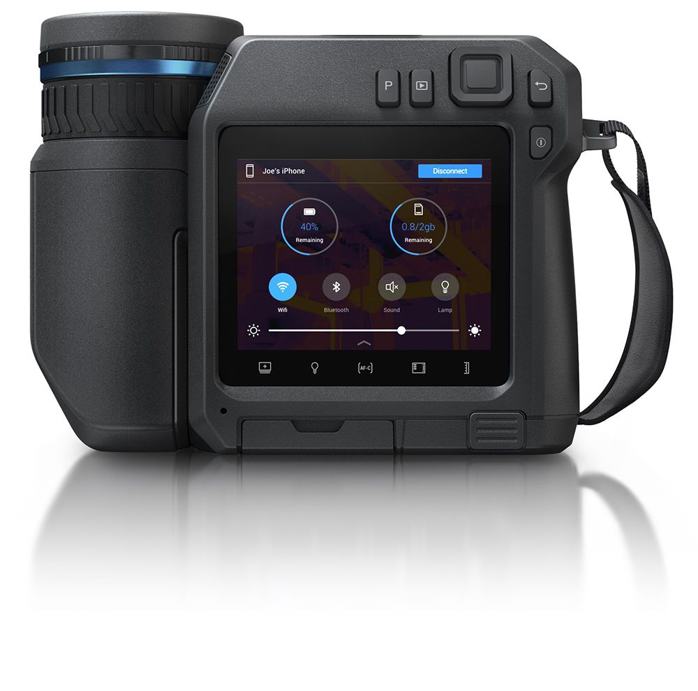 The FLIR T560 thermal camera in front view. The camera shows the various menu options.
